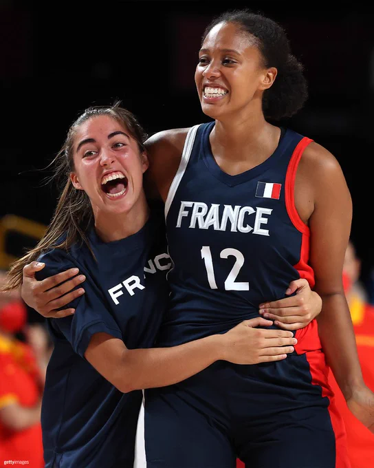 Iliana Rupert #12 of Team France and Marine Fauthoux #4 celebrate their victory over Team Spain in a Women's Basketball Quarterfinals game