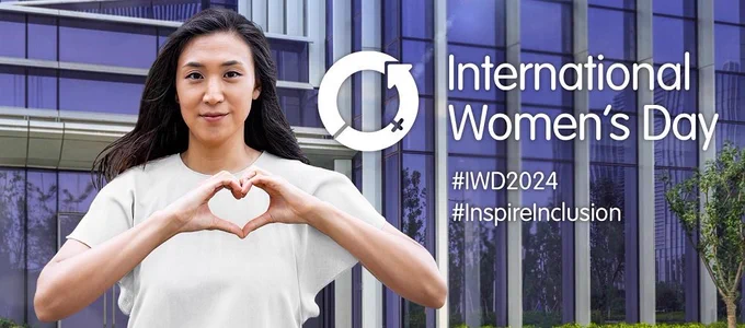 International Women's Day. Woman making a heart shape with her hands.