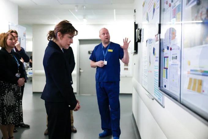 Victoria Atkins talking to staff members at Heatherwood Hospital.