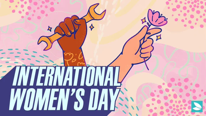 Soft hues of peach, pink, and yellow in the background, with scattered clusters of pink dots and teal dashed swirls. On the left, a brown arm with yellow flower tattoos is holding a wrench. To the right is a white hand holding a pink flower.  In the bottom left corner, in a bold italic font, are the words in all caps: “International Women’s Day” in light blue with an indigo shadow effect. Possibility Seeds logo in the bottom right corner.
