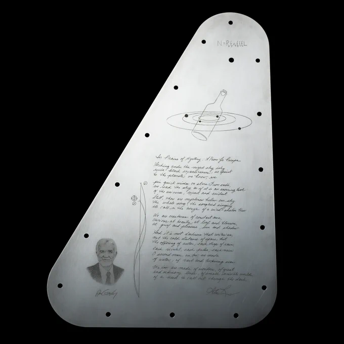 Full image of the Europa Clipper vault plate's inward-facing side, featuring the Drake Equation at the top, a portrait of Ron Greeley, shown as a bust, on the bottom left, a handwritten poem on the bottom right, and two curving lines intersecting between the portrait and the poem representing radio emission lines. The vault plate is metal silver and the engravings are black, set against a black background. 