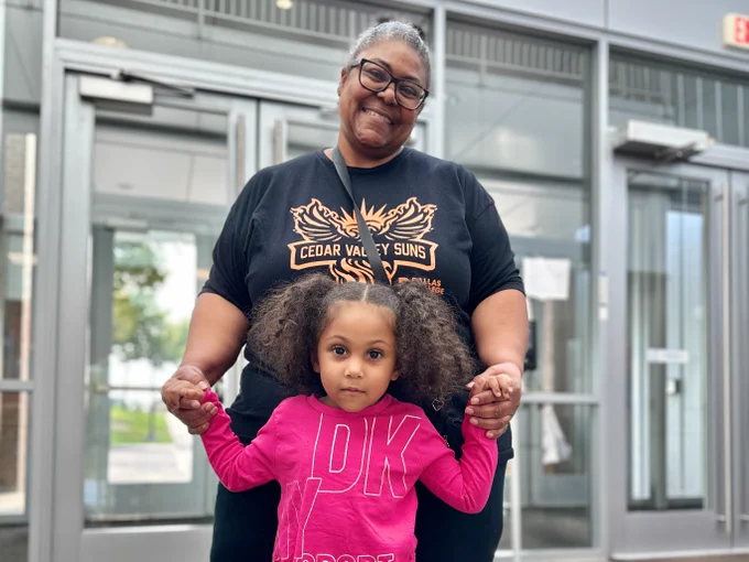 Staff member with her grandchild.