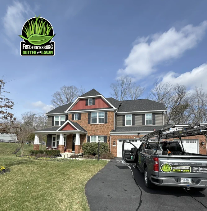 Fredericksburg Gutter and Lawn truck parked in a driveway after performing a gutter cleaning.