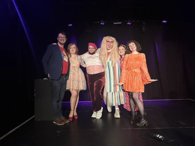 David Doherty Jebb, Rose Coogan, Hester Ectomy, Céilí Rae Minogue, Sara Jade Davison, and Kat McKnight all standing and posing on stage