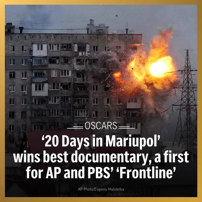 An explosion erupts from an apartment building after a Russian army tank fired on it in Mariupol, Ukraine, March 11, 2022. Text: Oscars: ‘20 Days in Mariupol’ wins best documentary, a first for AP and PBS’ ‘Frontline’