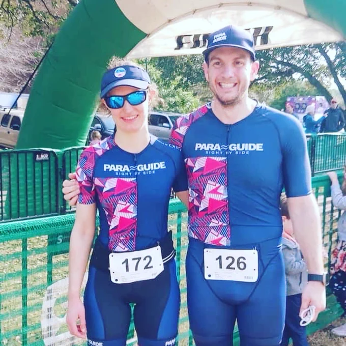 The team smiling at the finish in matching PG kits