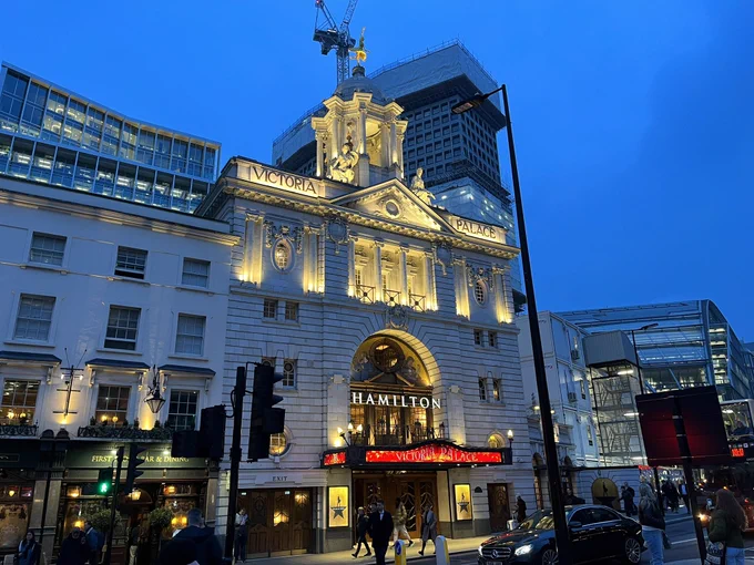 Twilight shot of the Victoria Palace Theatre where the musical Hamilton is playing.