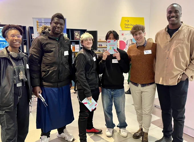 Cultural Connectors standing holding copies of the manifesto
