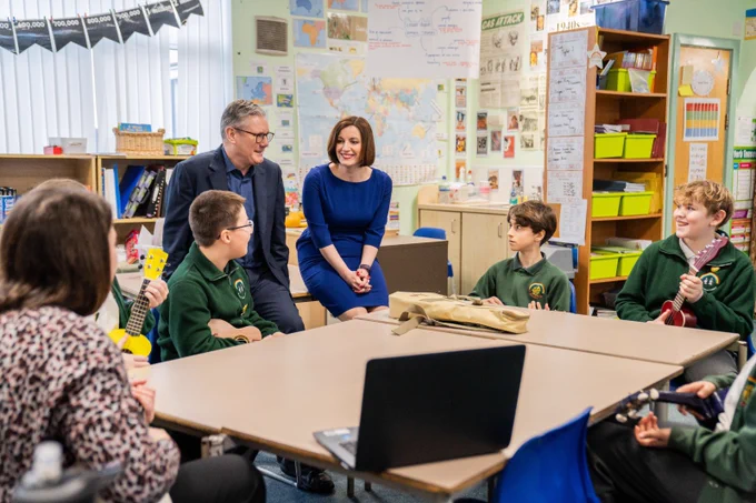 Keir Starmer MP, Leader of the Opposition, with Bridget Phillipson MP, Shadow Education Secretary, talking to children with musical instruments on a visit to a school in Harlow, March 2024.