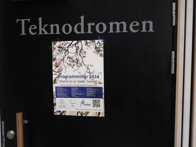 A <Programming> 2024 poster on the door to the main conference room: Teknodromen