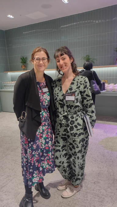 Two women in floral outfits