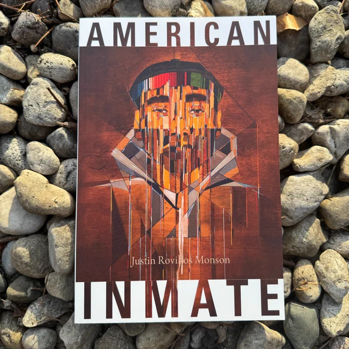 the cover of American Inmate by Justin Rovillos Monson displayed on a pile of gravel
