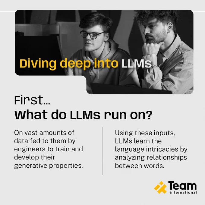 The image is in black and white. Two guys are watching a computer. They are thinking. It appears Team international logo