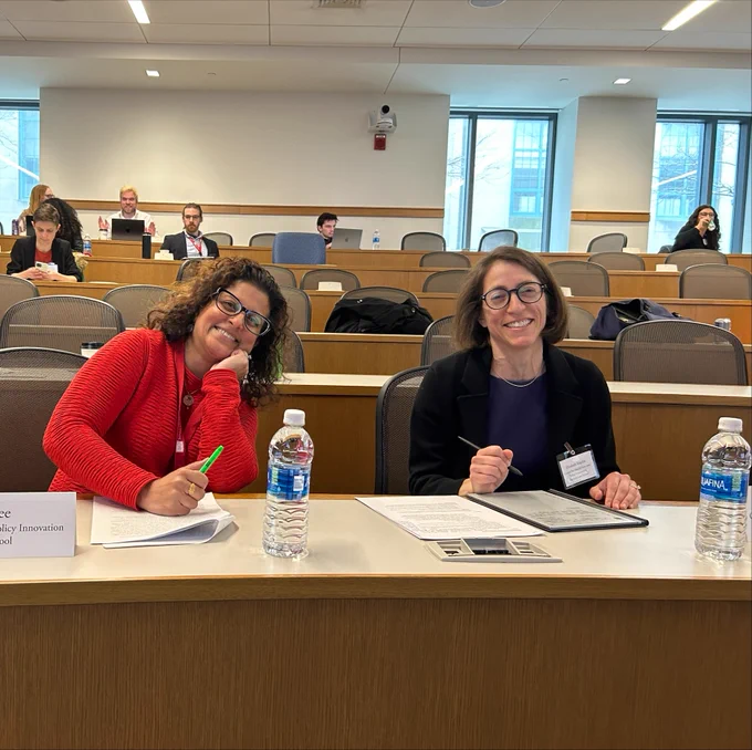 Anu Dairkee and Elizabeth Kaplan at the AJLM Symposium. 