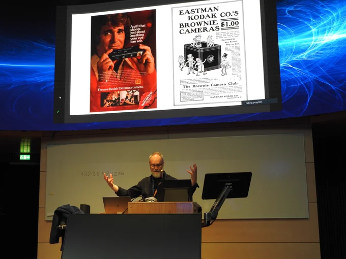 Photo of the PAI keynote speaker talking about photography and AI.
