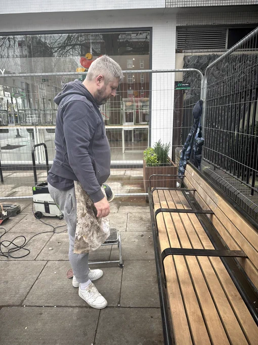 Bench at Sussex Gardens being sanded down.