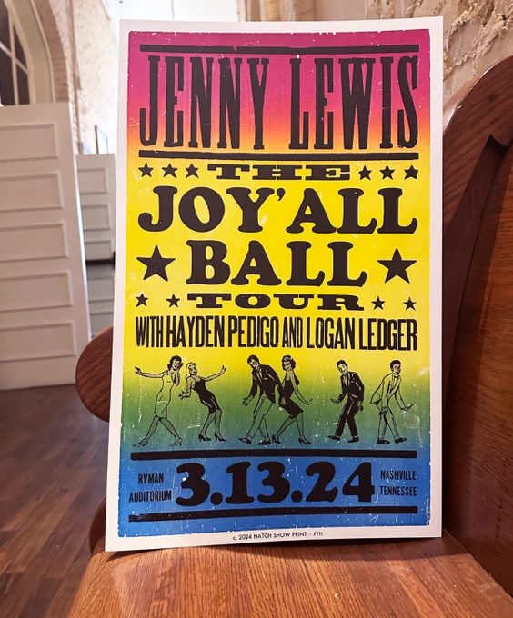 Jenny Lewis Hatch Show Print poster propped up in the pews at the Ryman 