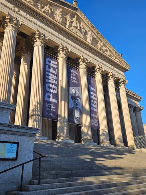 Large banners outside of the National Archives museum announcing the newest temporary exhibit.