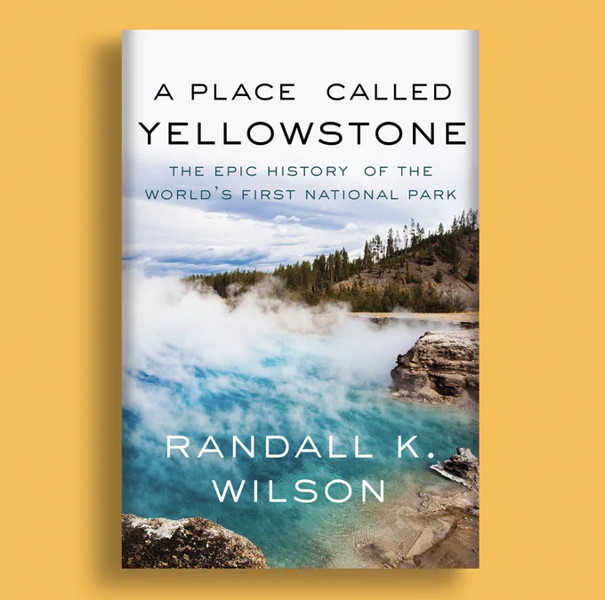A mockup of the cover of the book A Place Called Yellowstone by Randall K. Wilson. The cover shows a photo of steam rising from one of Yellowstone's iconic hot springs.
