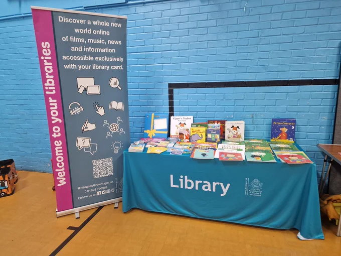 Photo of a library stall in a hall.