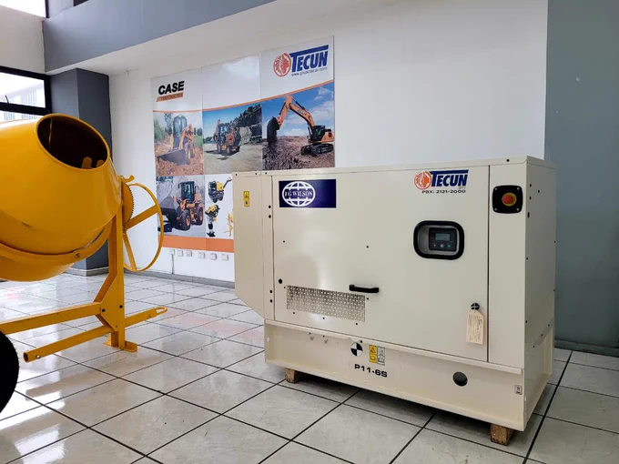 FG Wilson Sound Attenuated P11-6S diesel generator displayed prominently in Grupo Tecun's showroom in El Salvador, featuring its sleek design and compact size.
