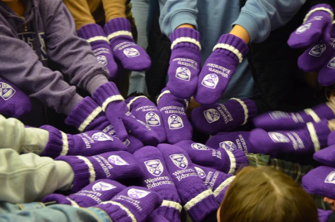 A group of FSL Western Education mittens gather together.