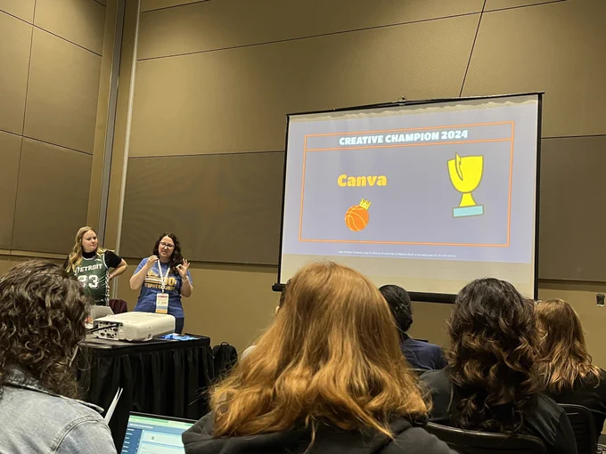 Becca and Priscila standing next to their presentation screen for elite 8 edtech creativity tools