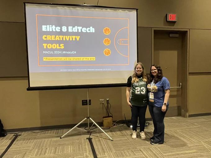 Becca and Priscila standing next to their presentation screen for elite 8 edtech creativity tools