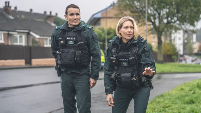 Actors Martin McCann and Sian Brooke wearing police uniform 