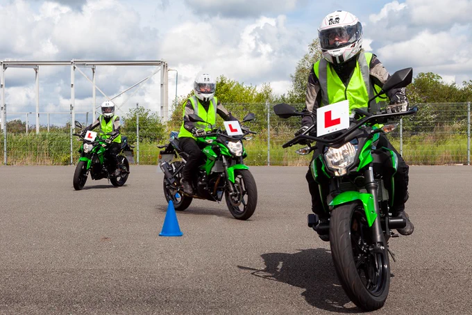 Image is of learner motorcyclists taking part in enhanced training.
