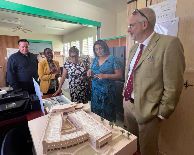 The delegation looking at a 3D model of the new hospital structure
