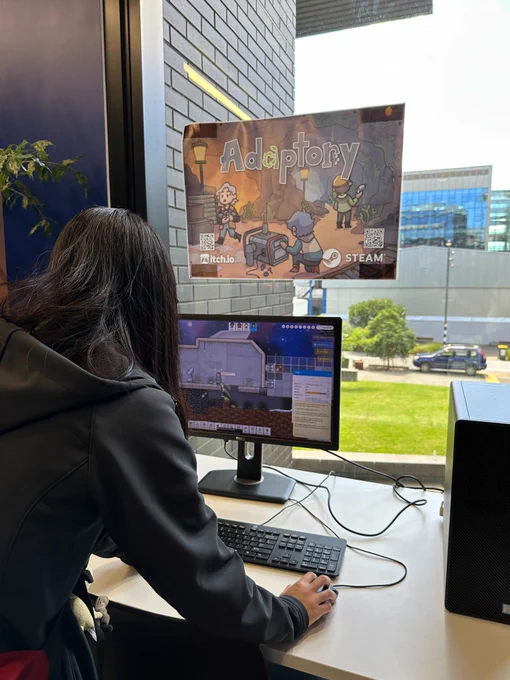 Photo of someone playing the Adaptory video game demo