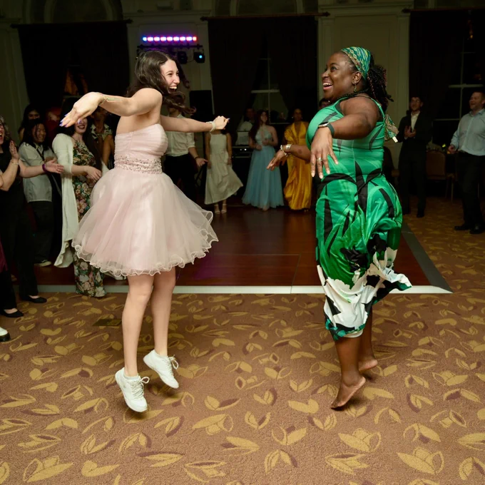 Professor Gizelle Sherwood dances with a student.