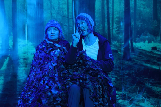 Julies terrifies her audience with ghost stories about desert islands, on Sheila's Island.