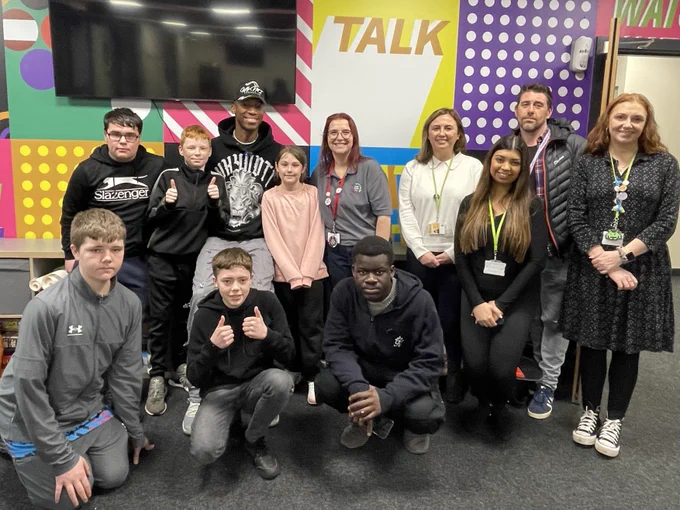 Young people with Kofi and staff at Leigh Youth Hub