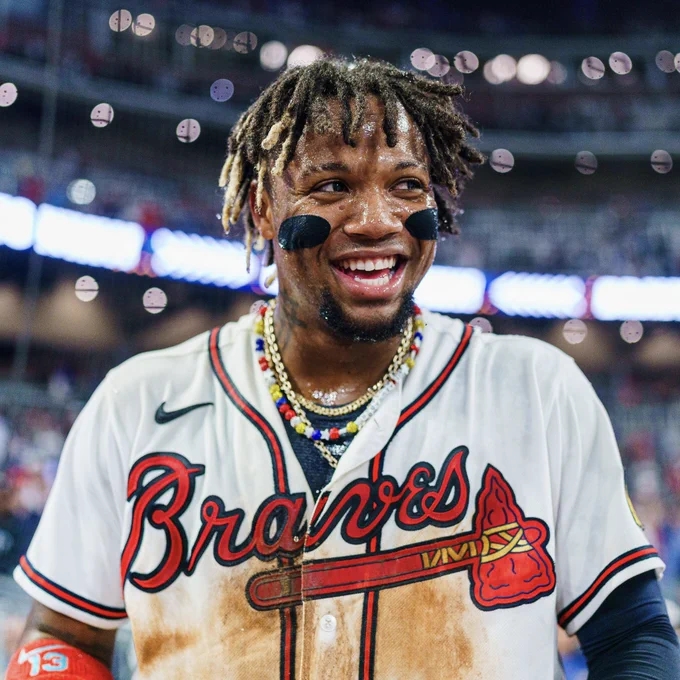 Ronald Acuña Jr. smiling after a win at Truist Park.