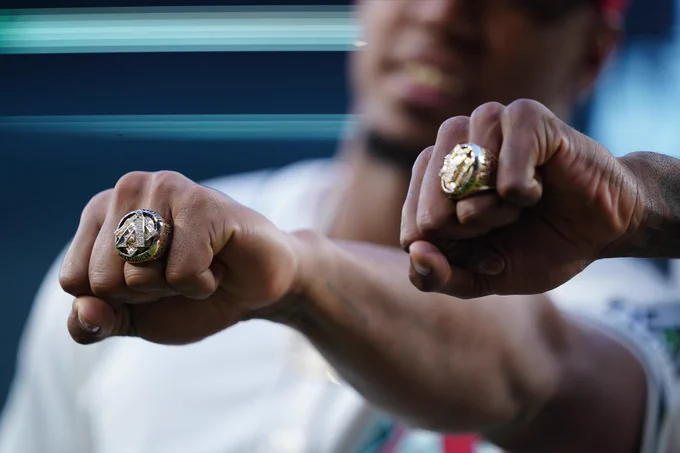 Two Arizona Diamondbacks 2023 National League Championship rings shown to the camera.