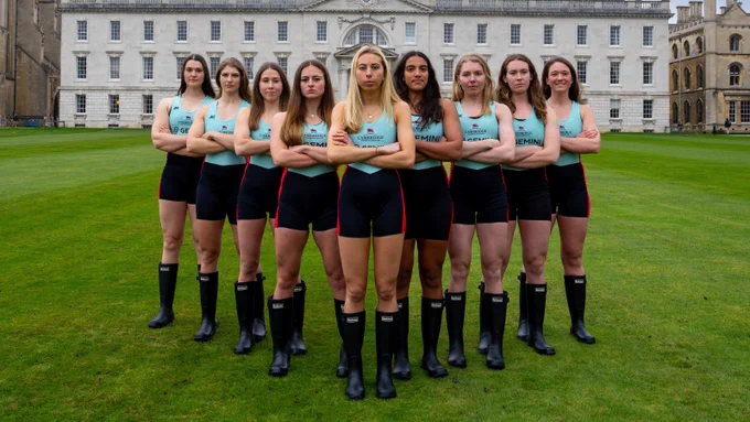 Women's Blue Boat crew standing in v-formation, arms crossed, ready to take Oxford on! Go light blue!