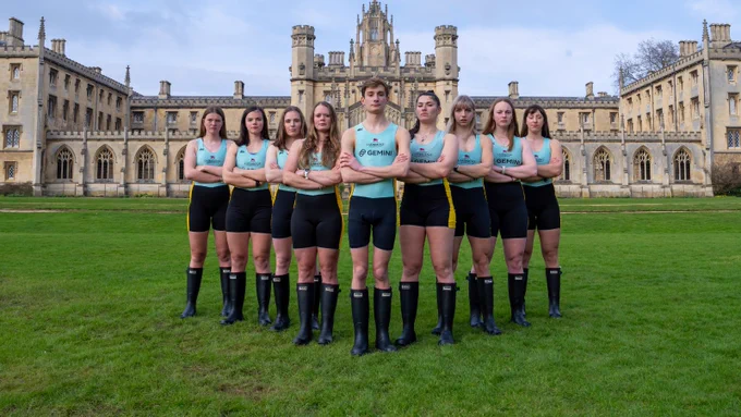 Reserve crew Blondie standing in v-formation, arms crossed, in front of St John's College