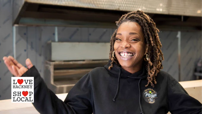 Karis, founder of Jerk Grill, poses at the new location of Jerk Grill, opening soon.