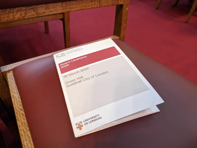 ICR Award Ceremony 2024 programme pictured on a red leather seat.
