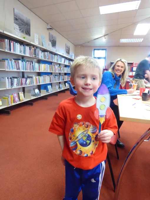 child with crafted rocket