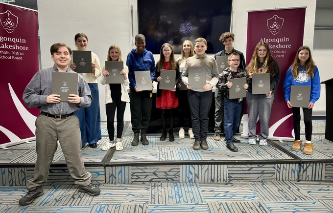 Eleven Beacon of Hope recipients with her certificates.