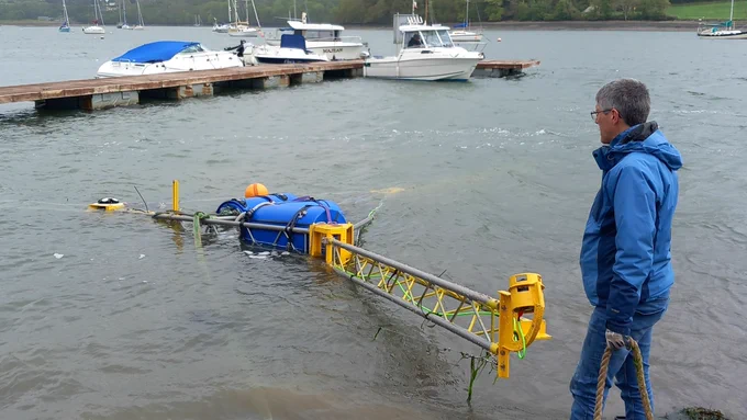 Professor Ian Masters working in a tidal river.