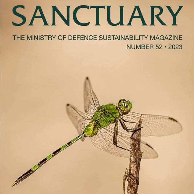 A magazine cover featuring a green dragonfly is seen resting on a twig over a brown background. At the top a title says SANCTUARY, above a subtitle which reads: The Ministry of Defence Sustainability Magazine. Number 52. 2023. 