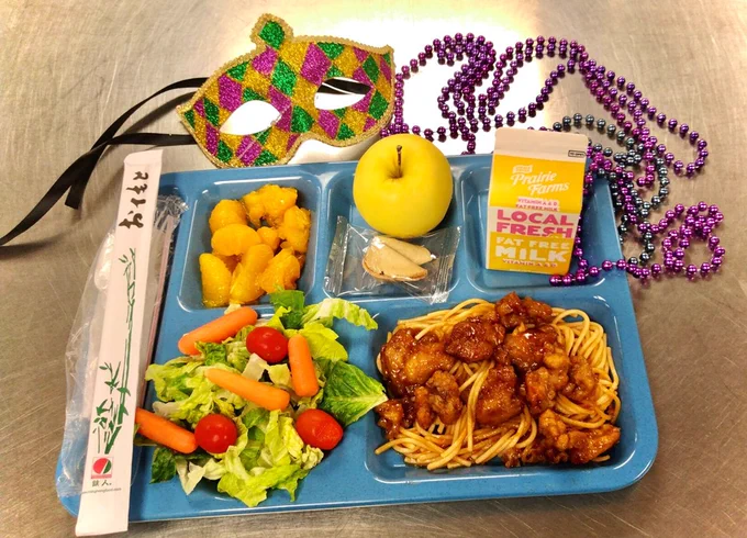 This tray features Orange chicken with whole grain Lo Mein noodles, fresh salad, golden delicious apple, mandarin oranges, and a fortune cookie! 