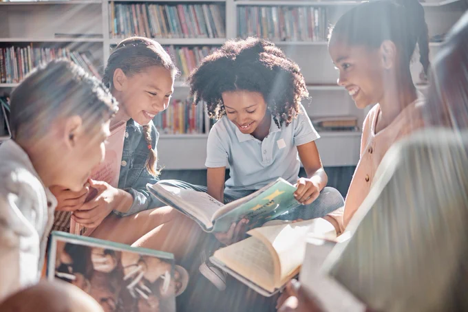 A group of children reading in a library 