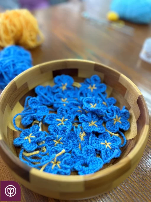Forget me nots crocheted for Dementia week 2024. Home Instead North Herts