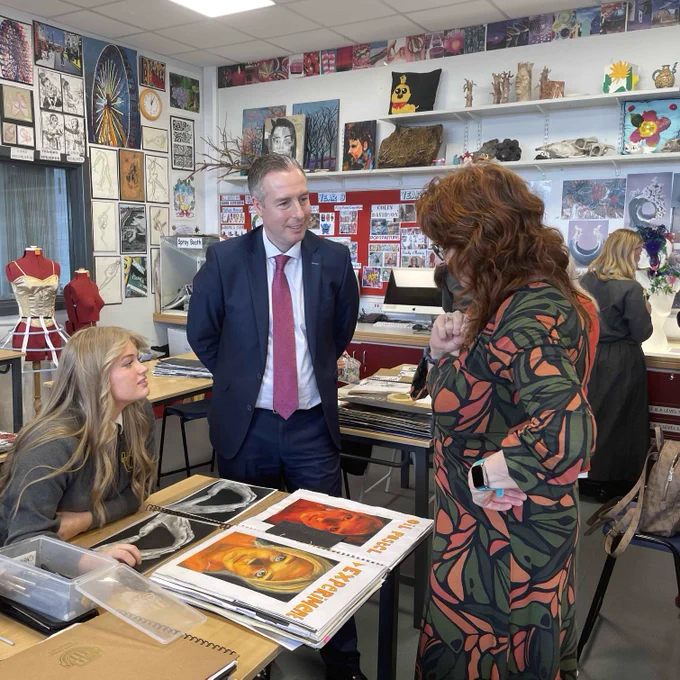 Education Minister Paul Givan viewing the tremendous art work by some of the pupils during a tour of the school