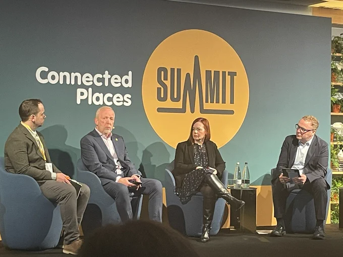 Group of people sat at a conference